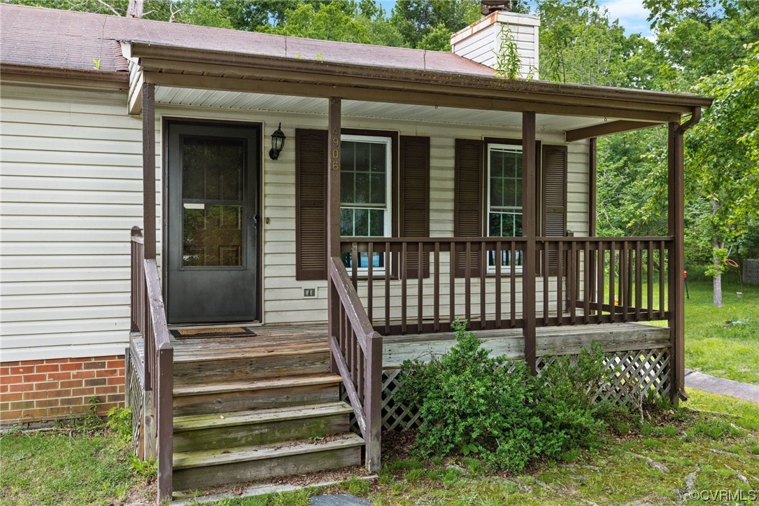 4906 Alberta Road Chesterfield, VA 23832 - Photo 2 of 21 a view of a house with a small deck and a garden