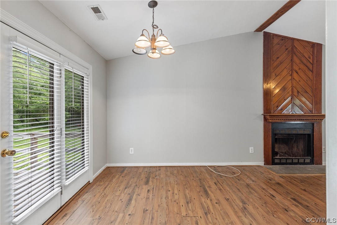 4906 Alberta Road Chesterfield, VA 23832 - Photo 5 of 21 a view of an empty room with wooden floor fireplace and a window