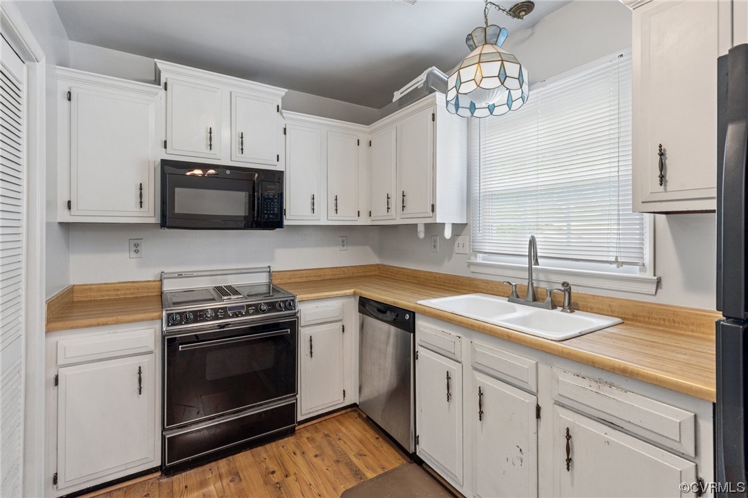 4906 Alberta Road Chesterfield, VA 23832 - Photo 6 of 21 a kitchen with granite countertop a stove a sink and dishwasher with wooden floor