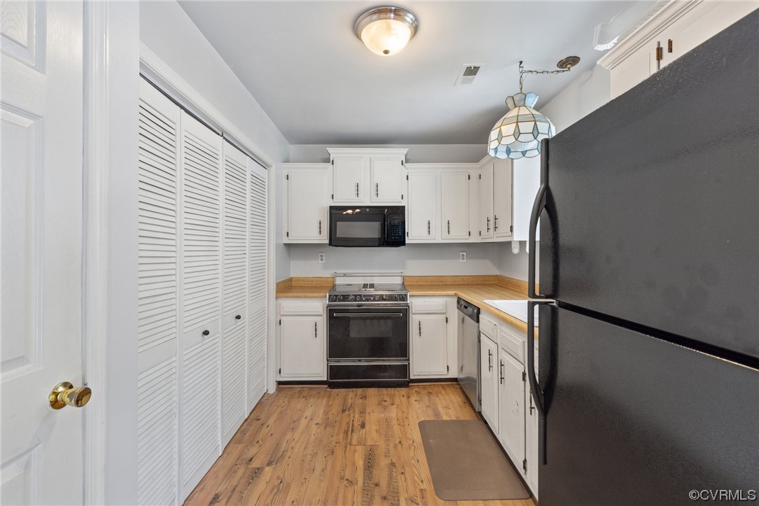 4906 Alberta Road Chesterfield, VA 23832 - Photo 8 of 21 a kitchen with stainless steel appliances a refrigerator sink and microwave