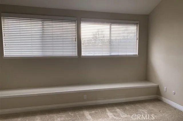 a bathroom with a bathtub and next to a window