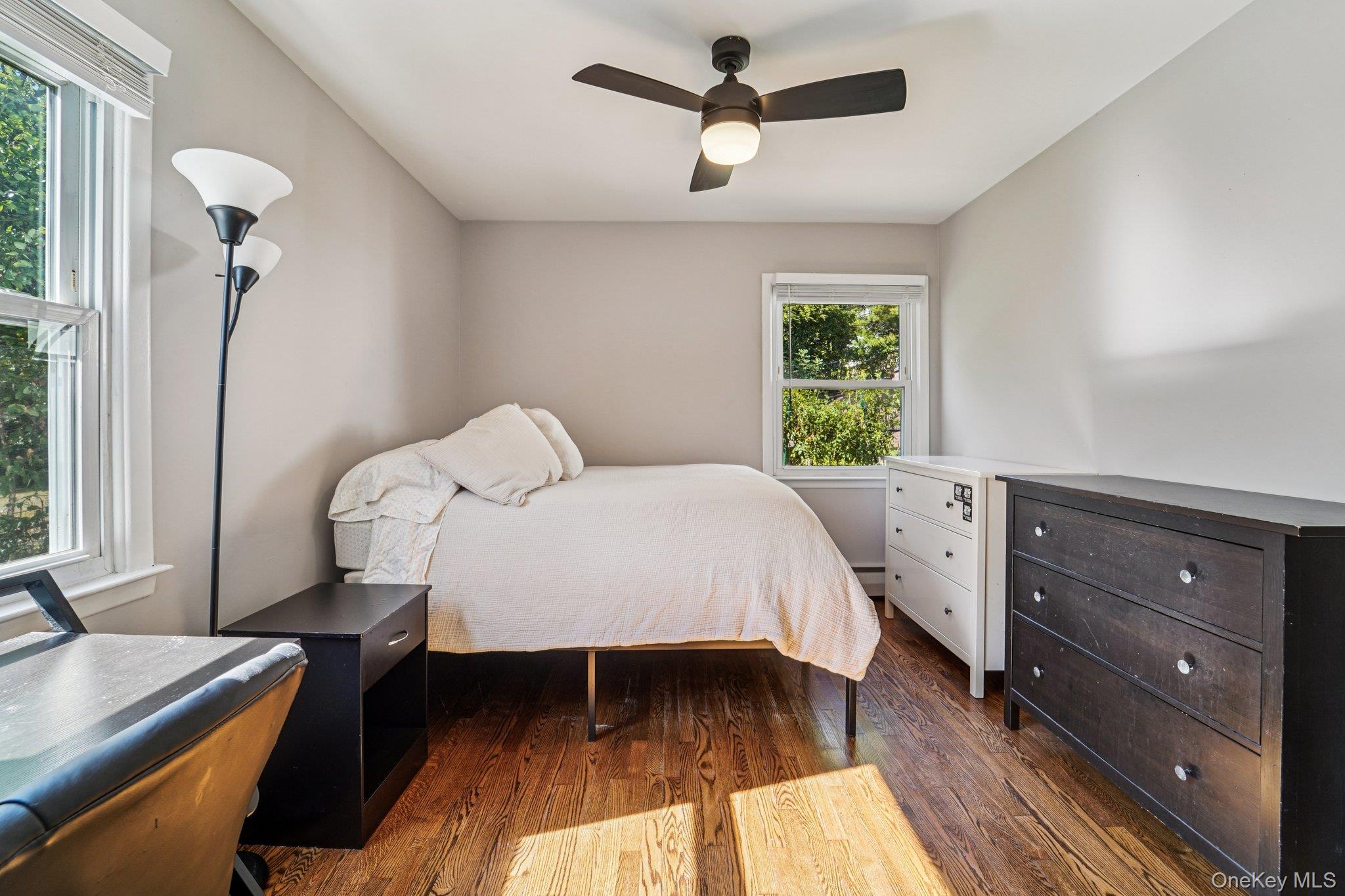 252 County Center Road White Plains, NY 10603 - Photo 17 of 44 Bedroom with dark wood finished floors and ceiling fan