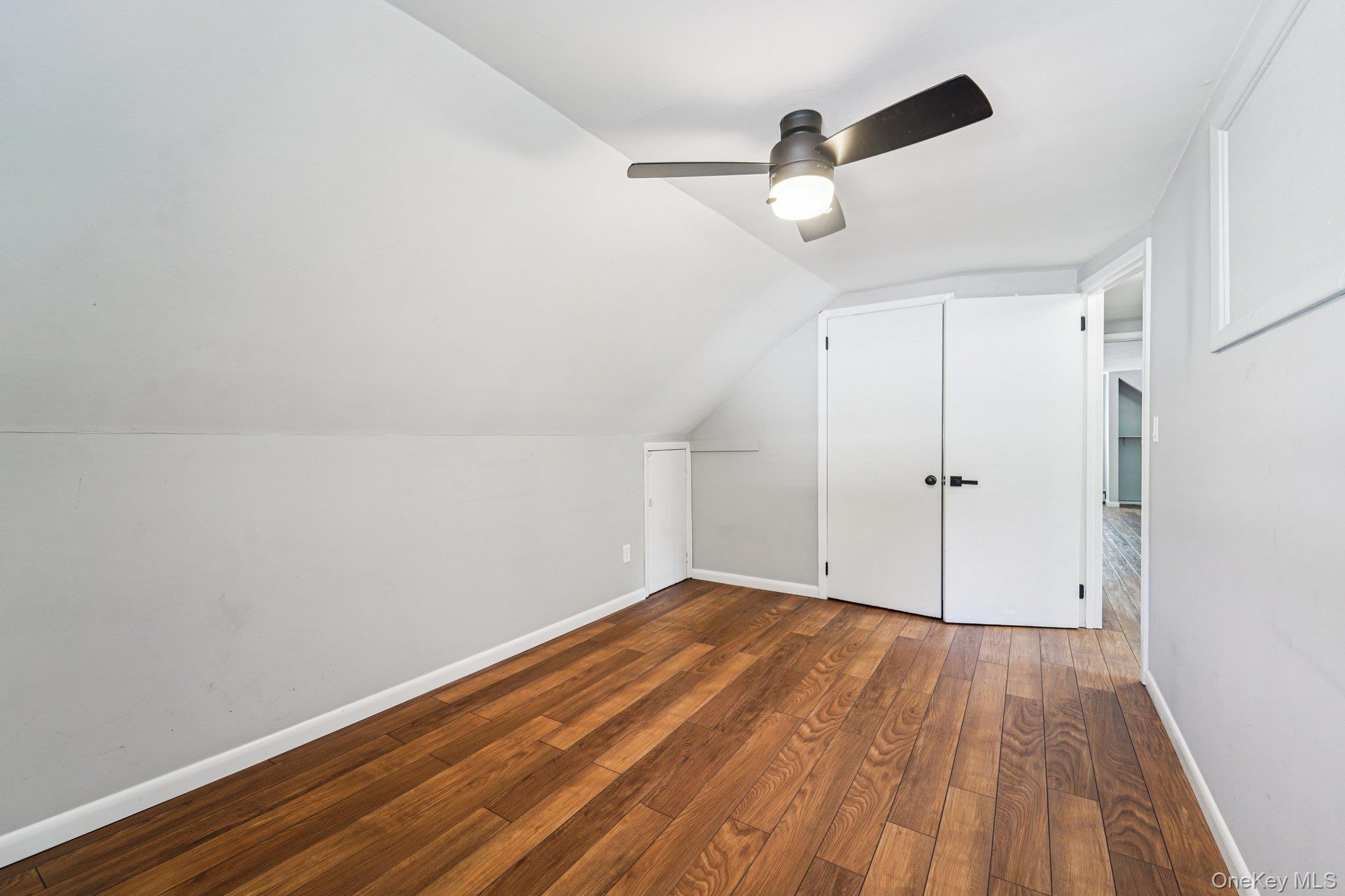 252 County Center Road White Plains, NY 10603 - Photo 19 of 44 Bonus room with hardwood / wood-style floors, lofted ceiling, and a ceiling fan