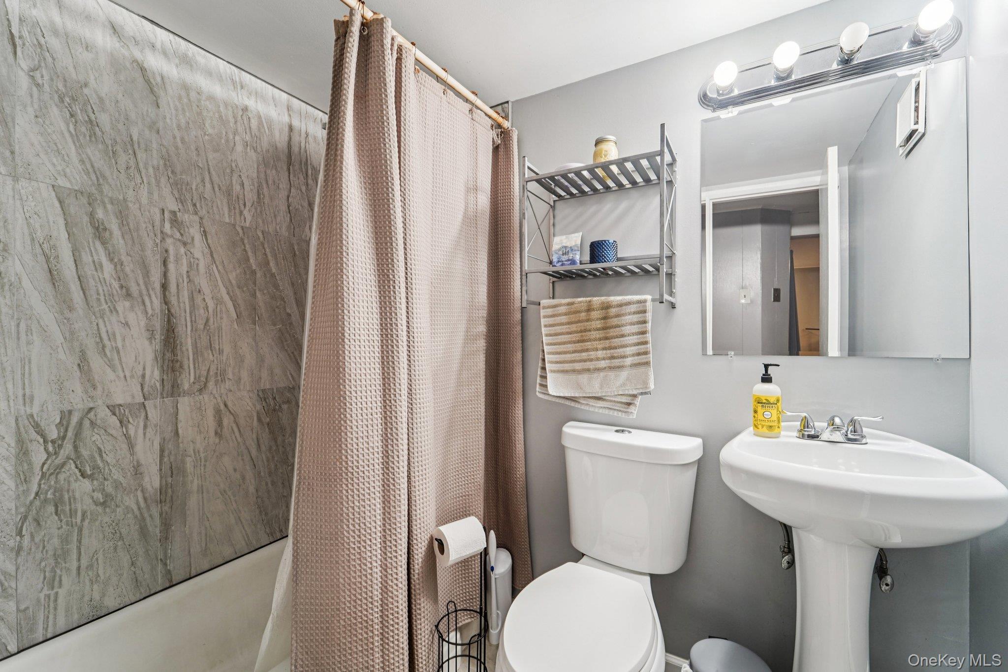 252 County Center Road White Plains, NY 10603 - Photo 24 of 44 Bathroom with toilet and shower / bath combo with shower curtain