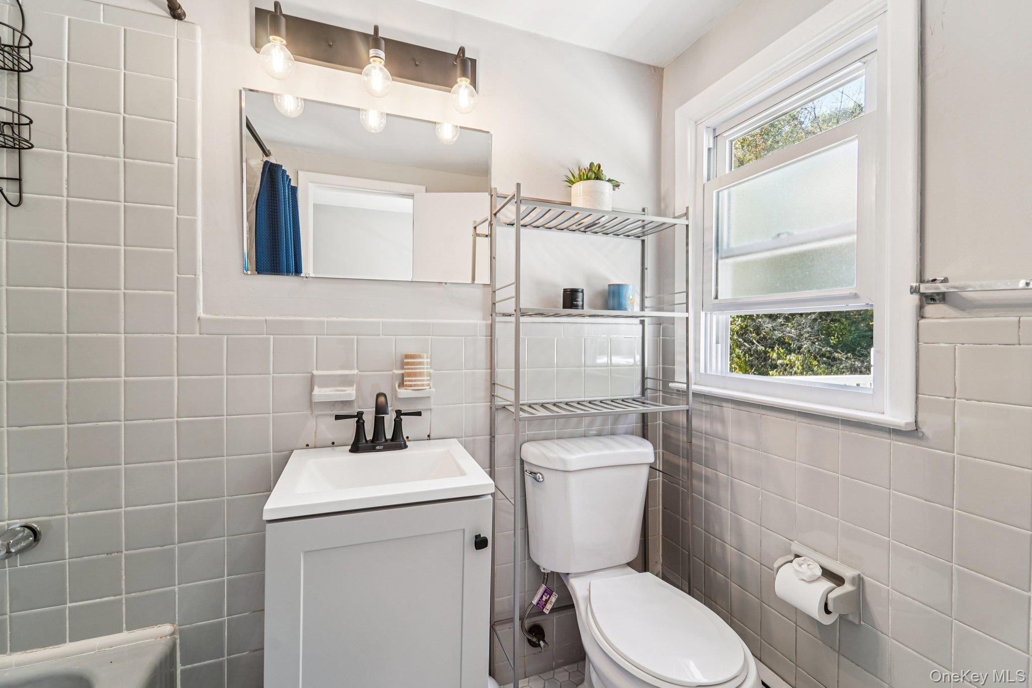 252 County Center Road White Plains, NY 10603 - Photo 26 of 44 Full bathroom with tile walls and vanity