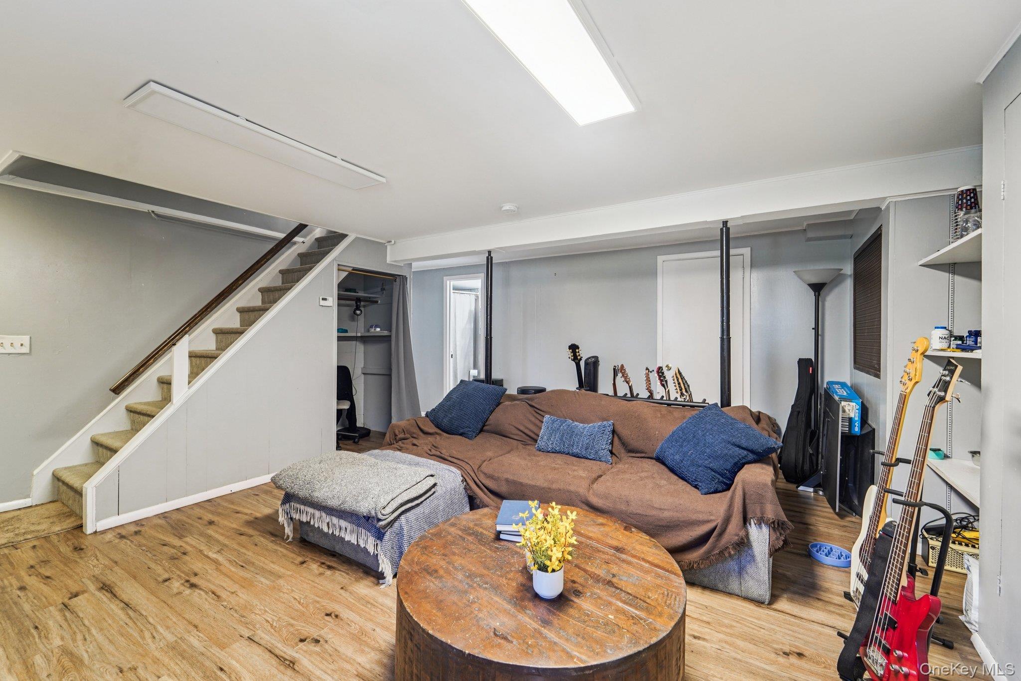 252 County Center Road White Plains, NY 10603 - Photo 31 of 44 Living area with wood finished floors and stairs