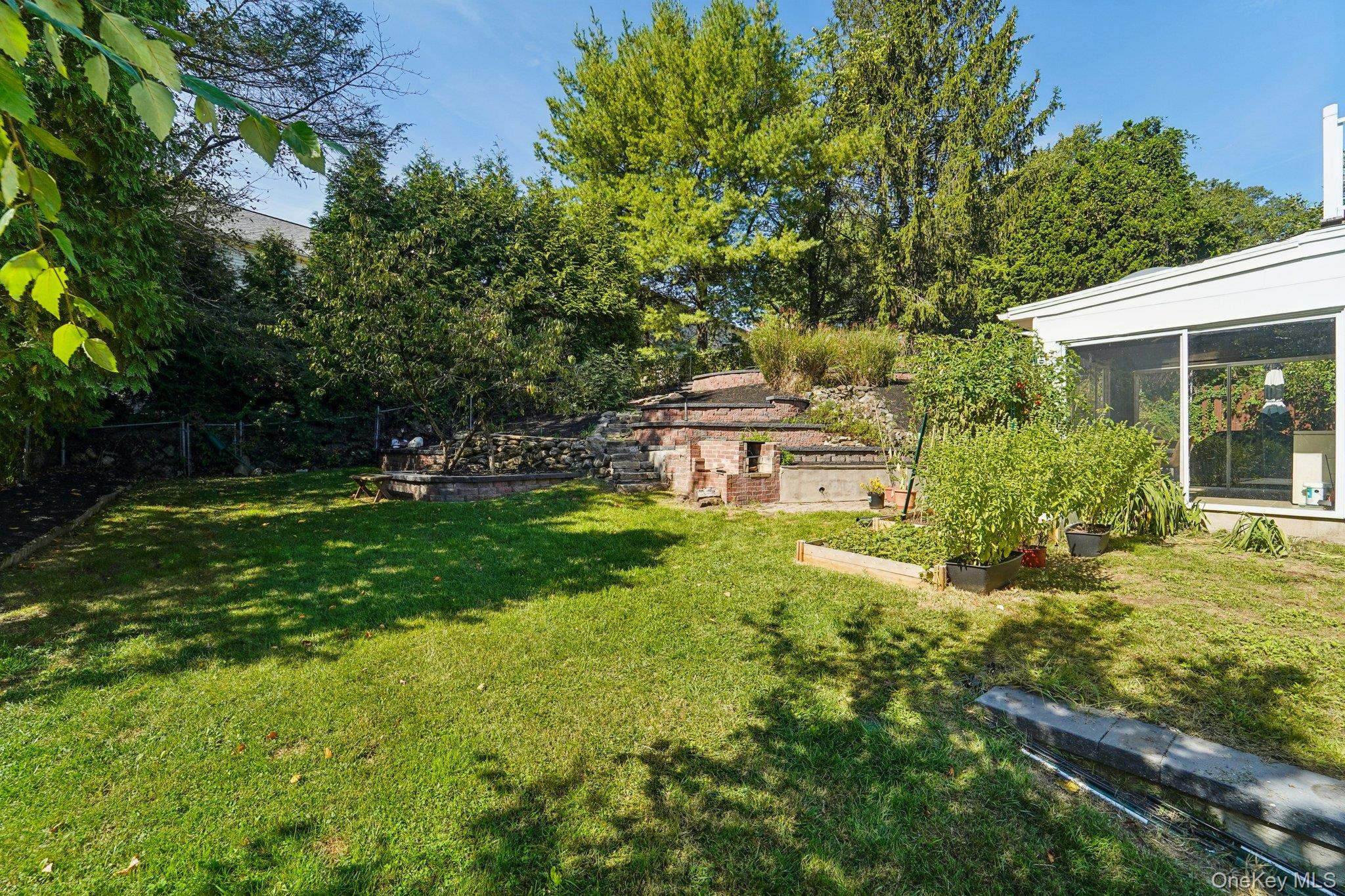 252 County Center Road White Plains, NY 10603 - Photo 39 of 44 View of yard with a vegetable garden and a sunroom