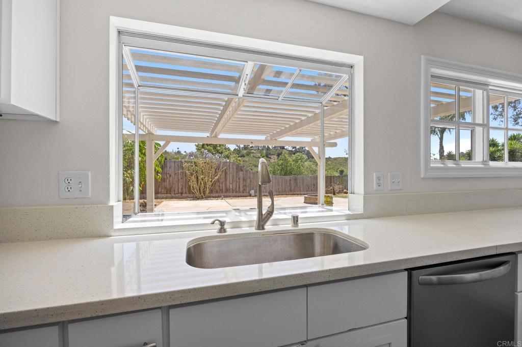 4595 Blackwell Road Oceanside, CA 92056 - Photo 16 of 47 a kitchen with a sink and large window
