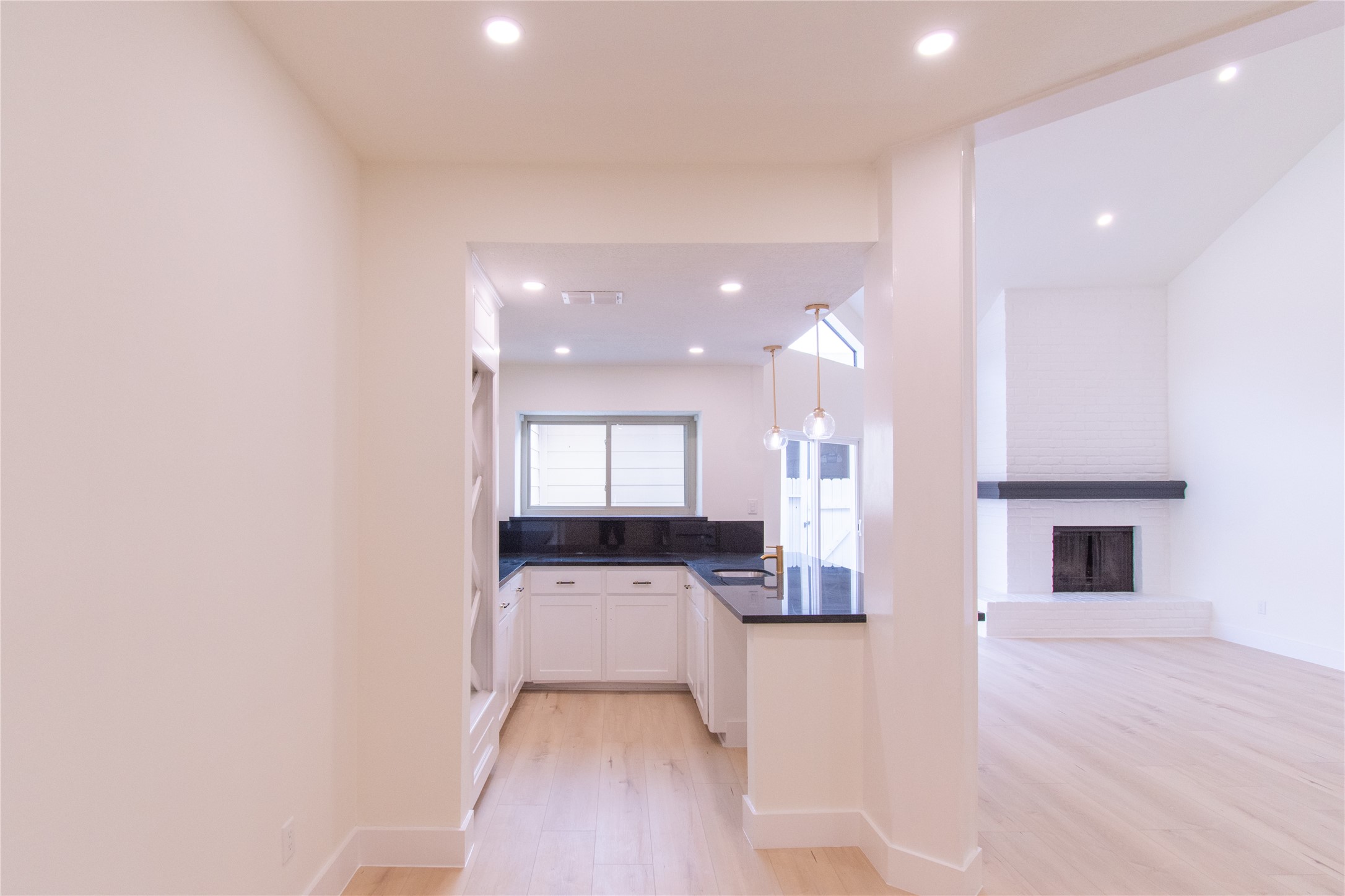 727 Bunker Hill Road, Unit 43 Houston, TX 77024 - Photo 6 of 34 Light vinyl flooring adds warmth and continuity throughout the space.