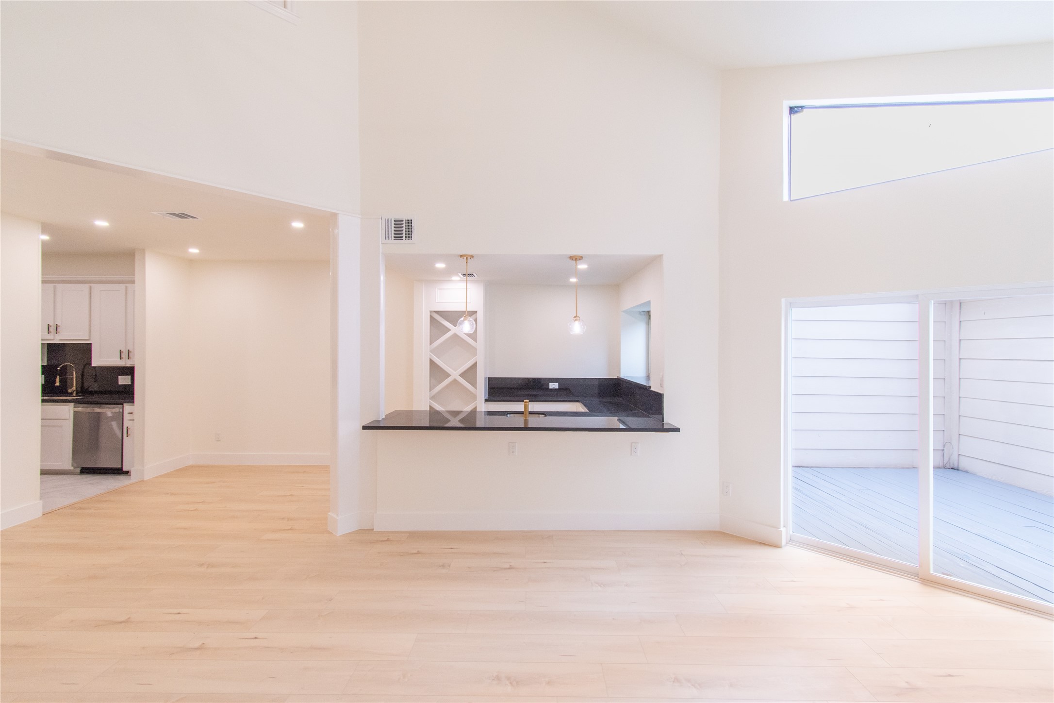 727 Bunker Hill Road, Unit 43 Houston, TX 77024 - Photo 8 of 34 The large sliding doors open to a private deck area, enhancing the airy feel.
