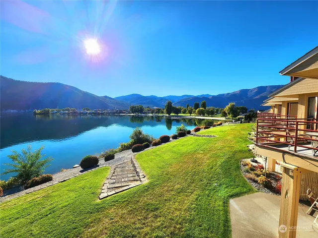 a view of a lake with a yard