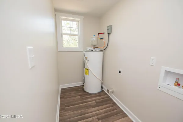 a view of a storage & utility room with a window