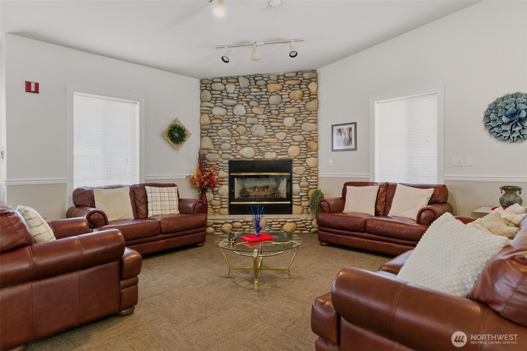 24036 222nd Avenue Southeast Maple Valley, WA 98038 - Photo 37 of 37 a living room with furniture and a fireplace