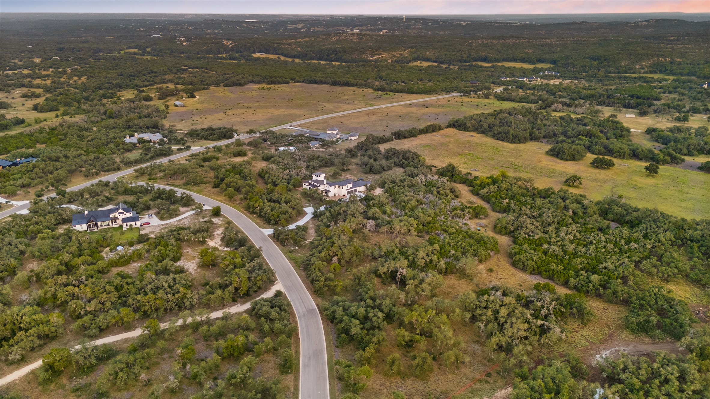Lot 17 Mesa Rnch Road Dripping Springs, TX 78620 - Photo 9 of 9 An aerial perspective captures the vast rolling countryside and surrounding acreage of this estate.