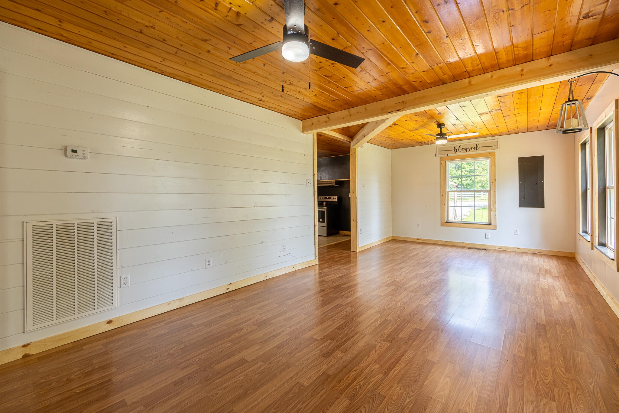 146 County Road 677 Riceville, TN 37370 - Photo 5 of 32 a view of an empty room with wooden floor and a window
