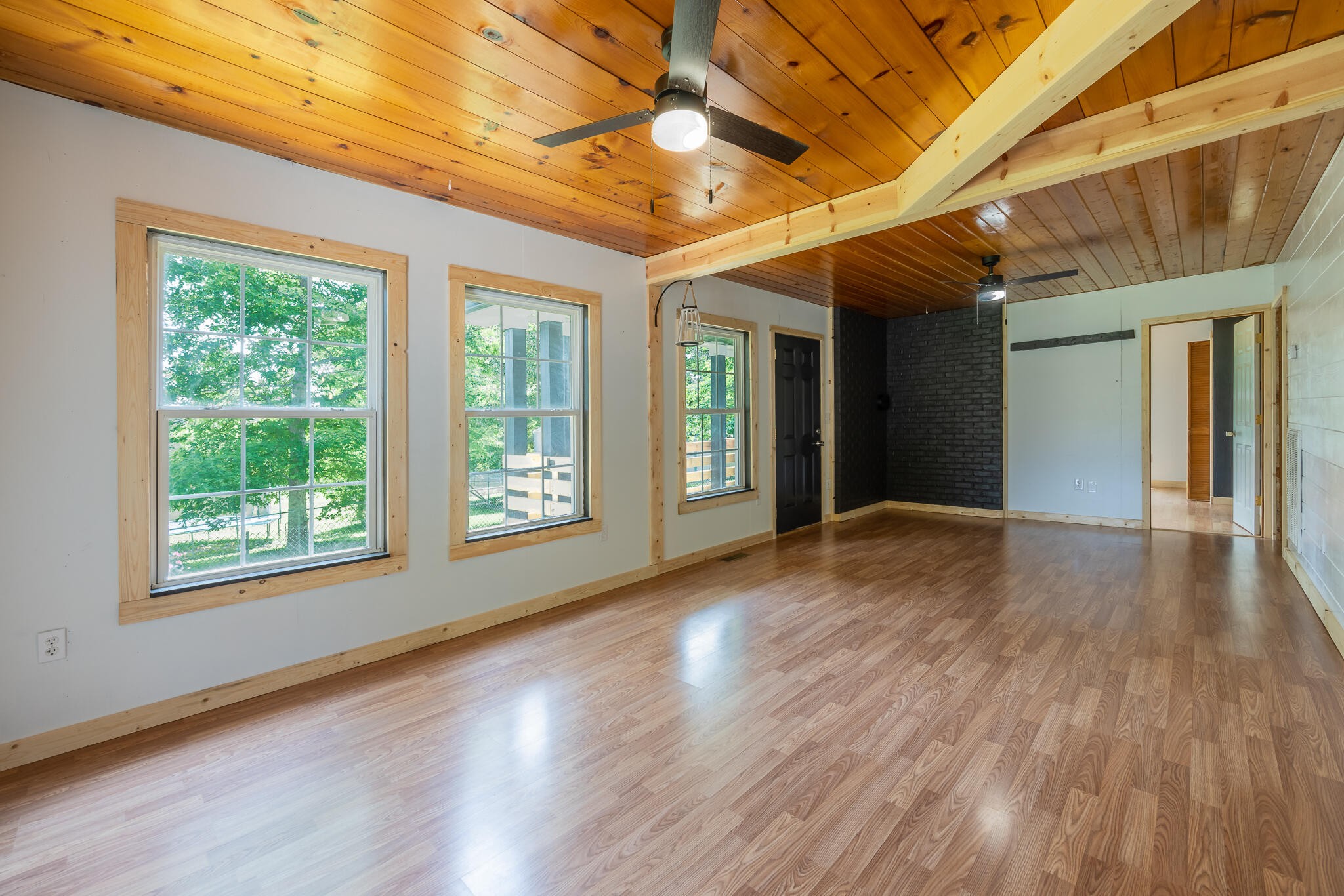 146 County Road 677 Riceville, TN 37370 - Photo 6 of 32 a view of an empty room with wooden floor and a window