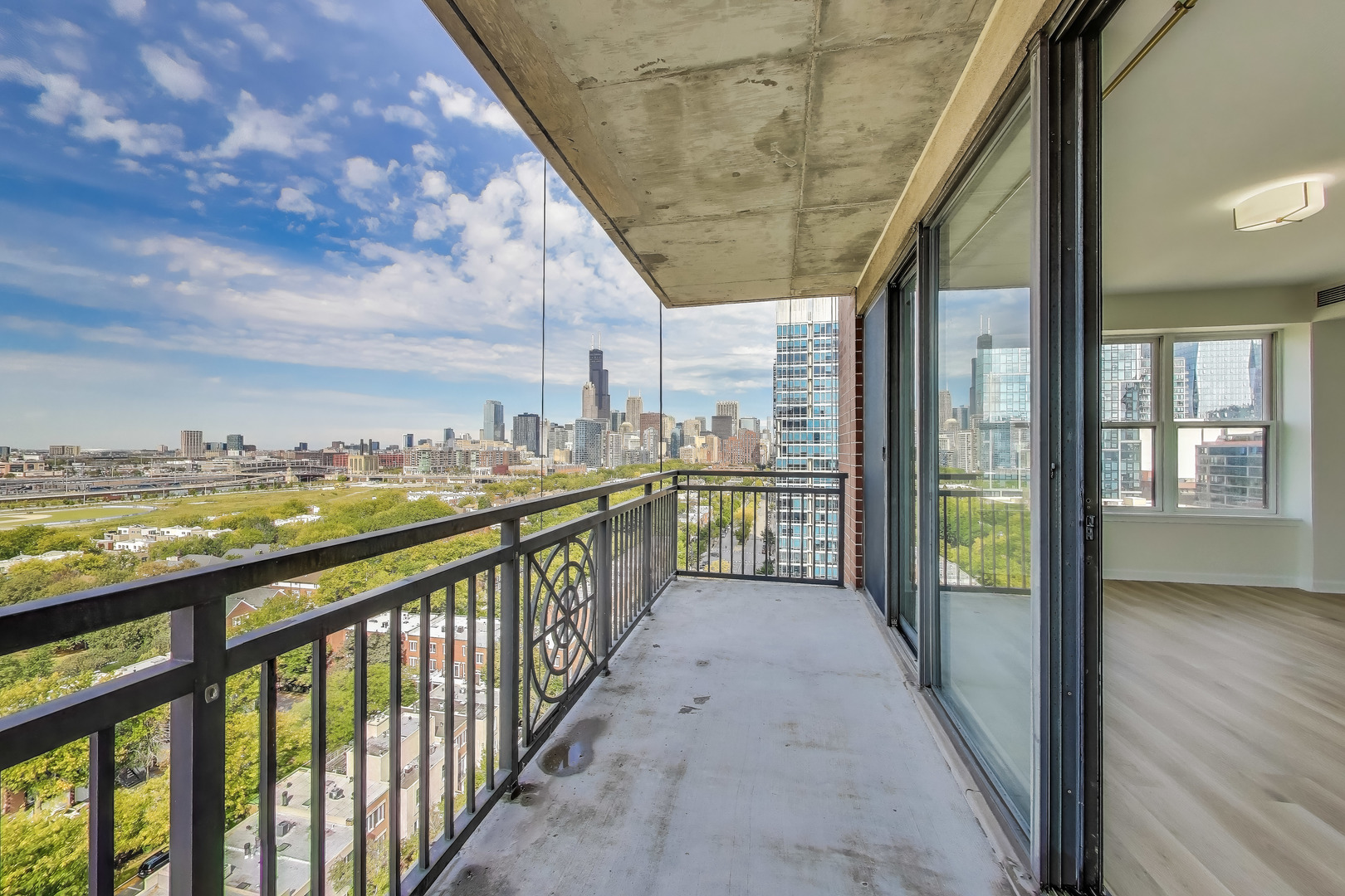 5 East 14th Place, Unit 1405 Chicago, IL 60605 - Photo 22 of 33 a view of a porch with wooden floor and outdoor space