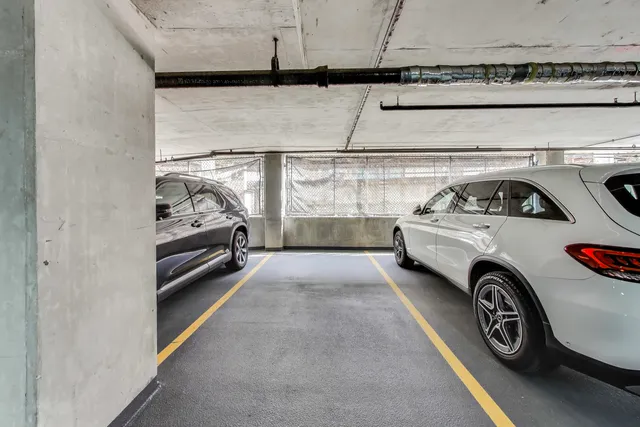 a view of a house with a patio and a yard