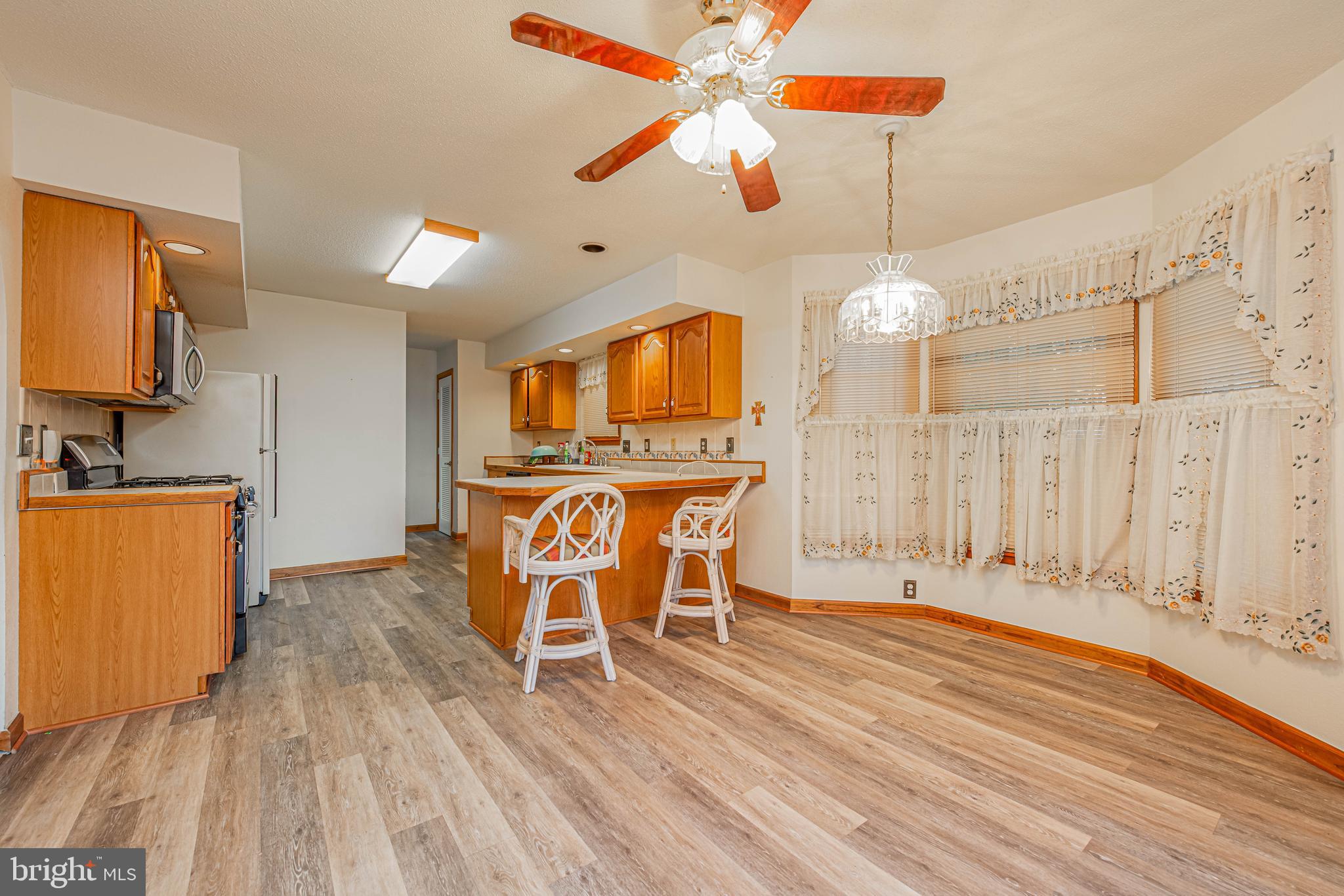 35772 Egret Road Selbyville, DE 19975 - Photo 20 of 38 a dining room with furniture and wooden floor