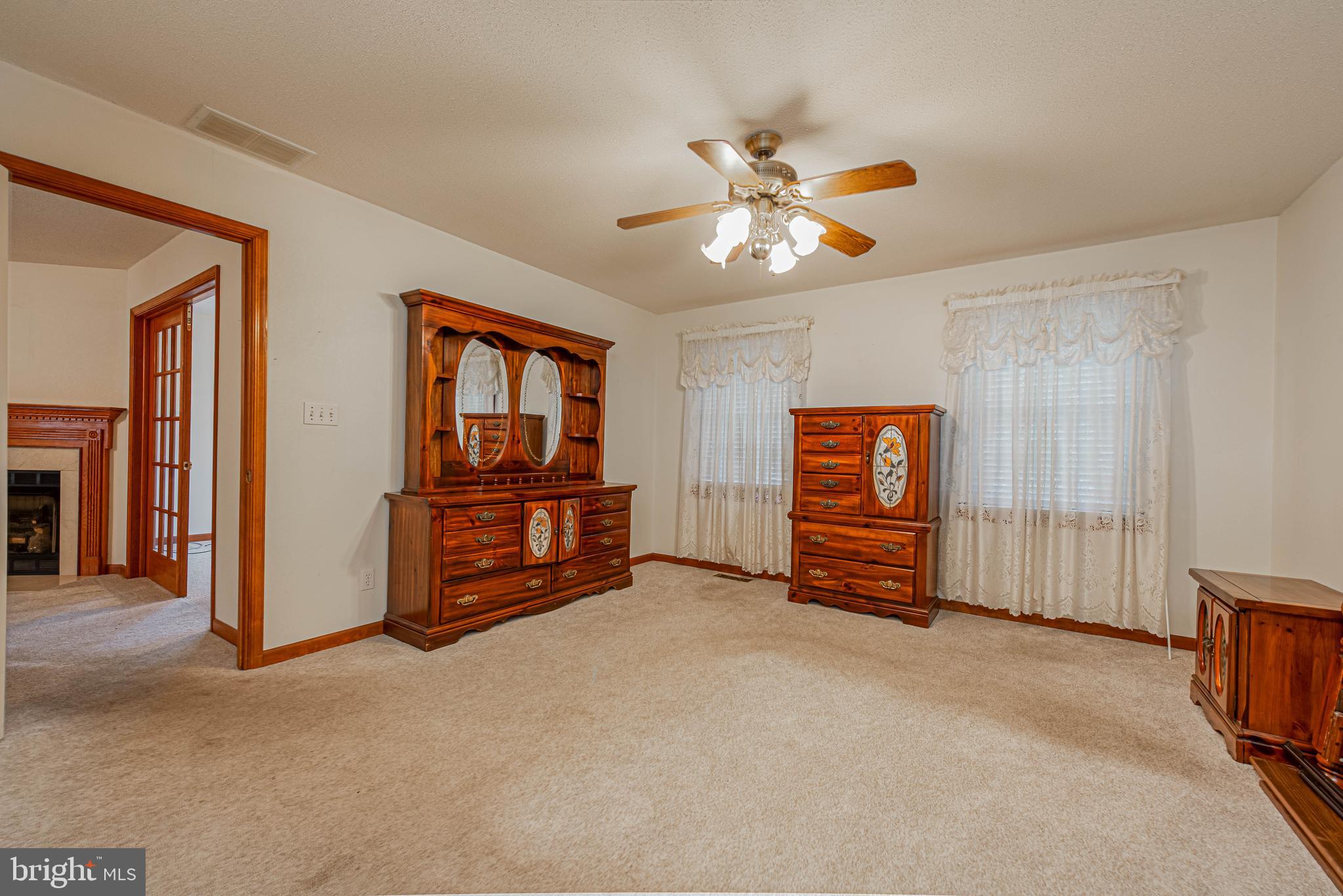 35772 Egret Road Selbyville, DE 19975 - Photo 25 of 38 a view of an empty room with window and cabinet