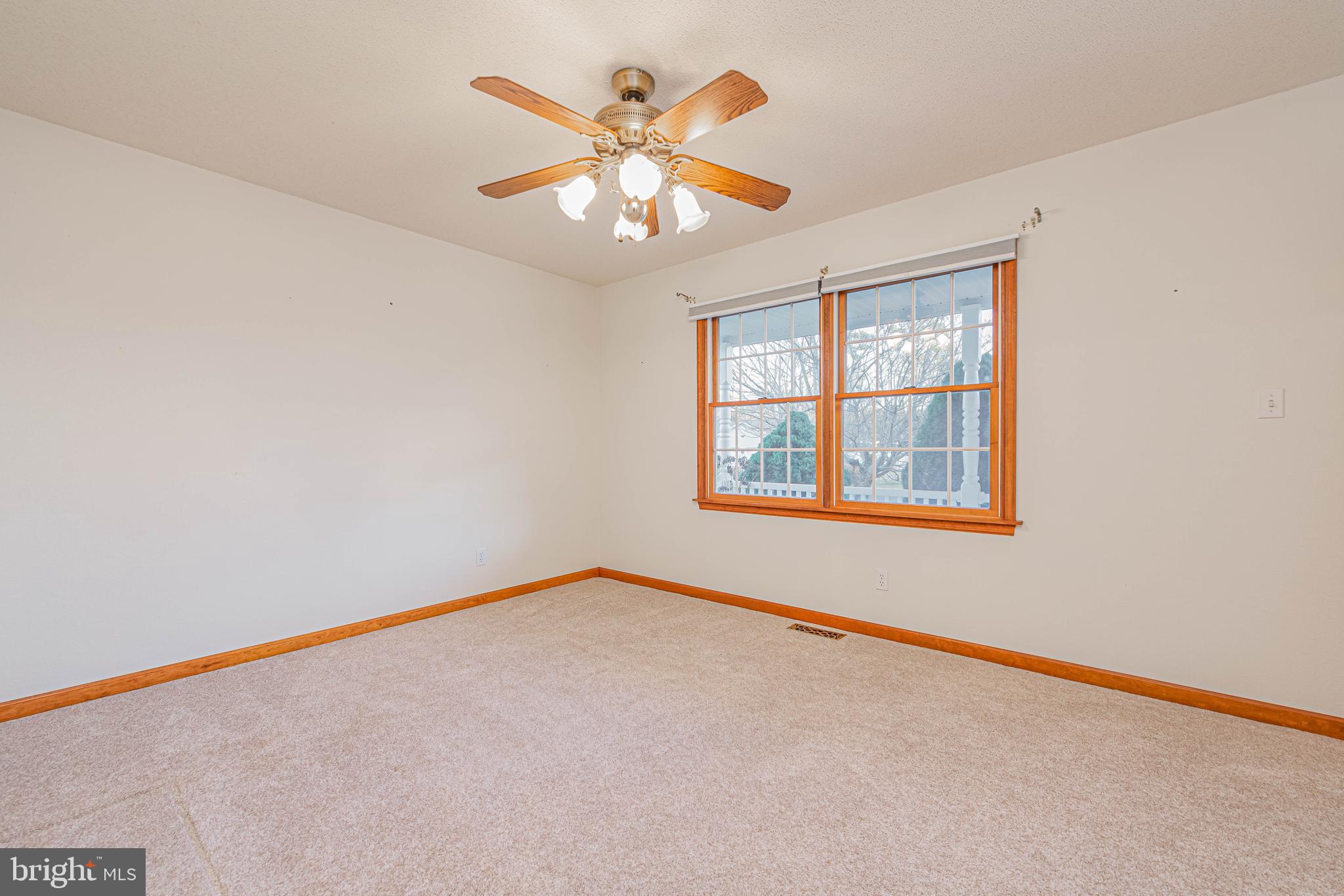 35772 Egret Road Selbyville, DE 19975 - Photo 28 of 38 an empty room with windows and fan