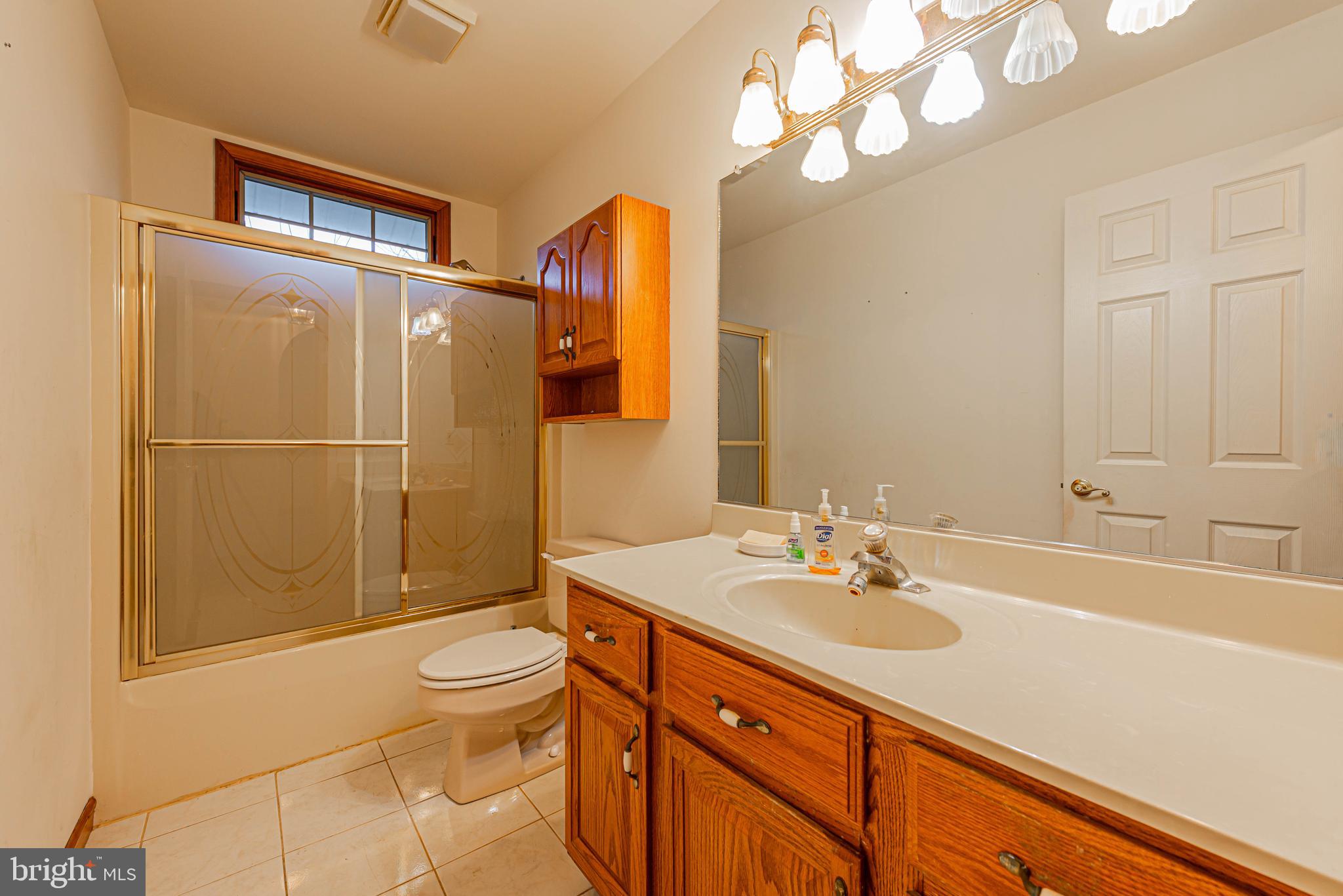 35772 Egret Road Selbyville, DE 19975 - Photo 32 of 38 a bathroom with a sink a toilet and shower