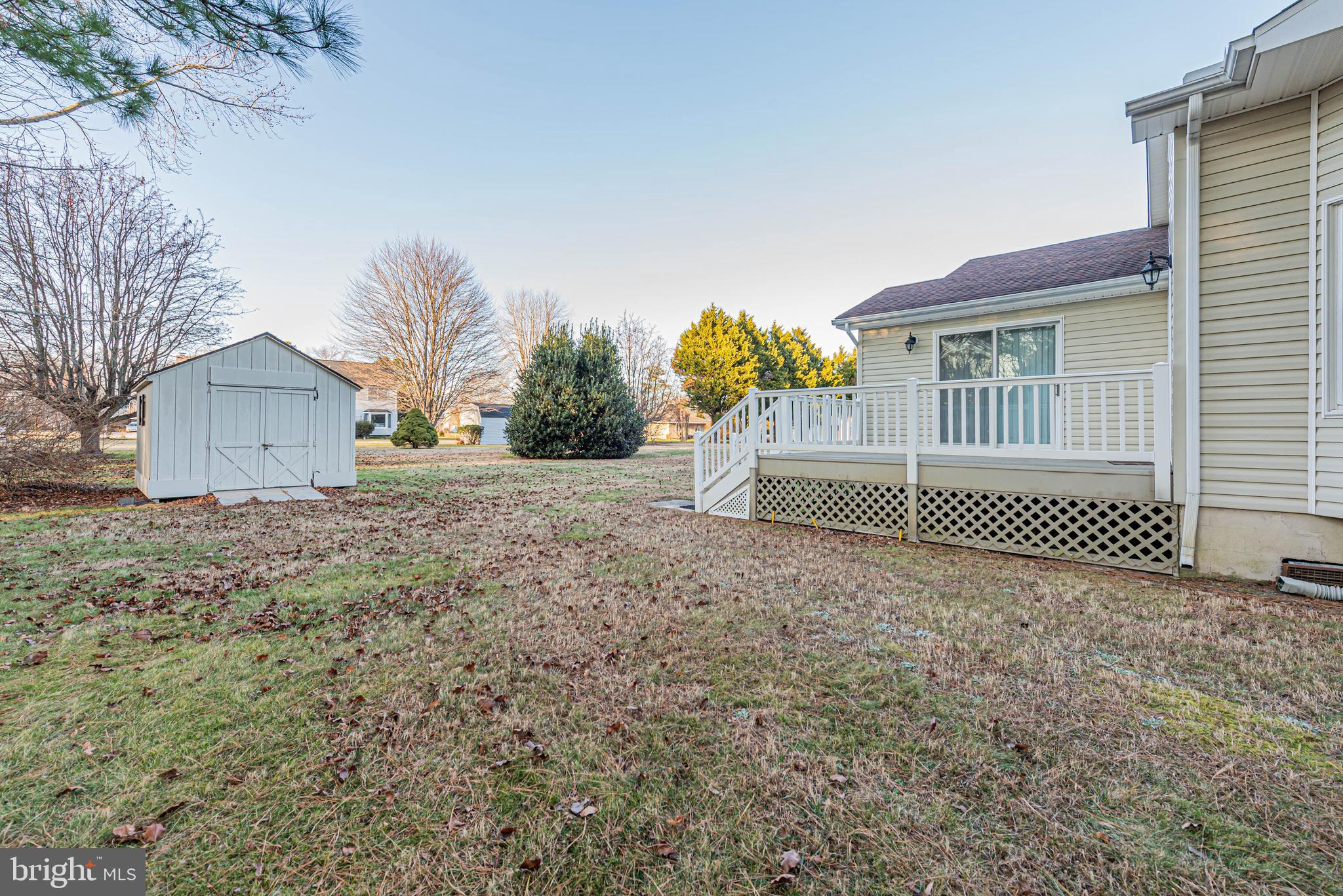 35772 Egret Road Selbyville, DE 19975 - Photo 5 of 38 a front view of a house with a yard and garage