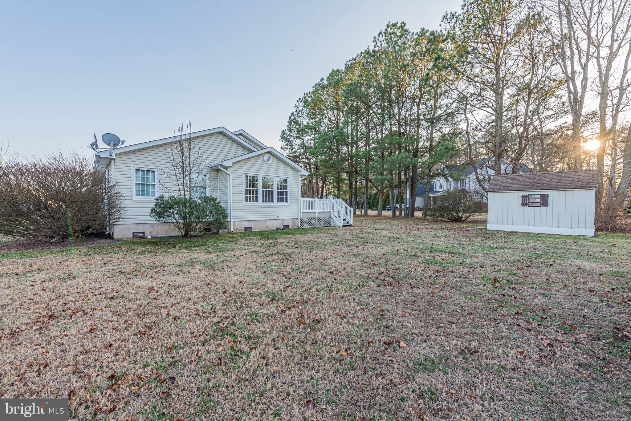 35772 Egret Road Selbyville, DE 19975 - Photo 7 of 38 a view of a house with a yard and plants