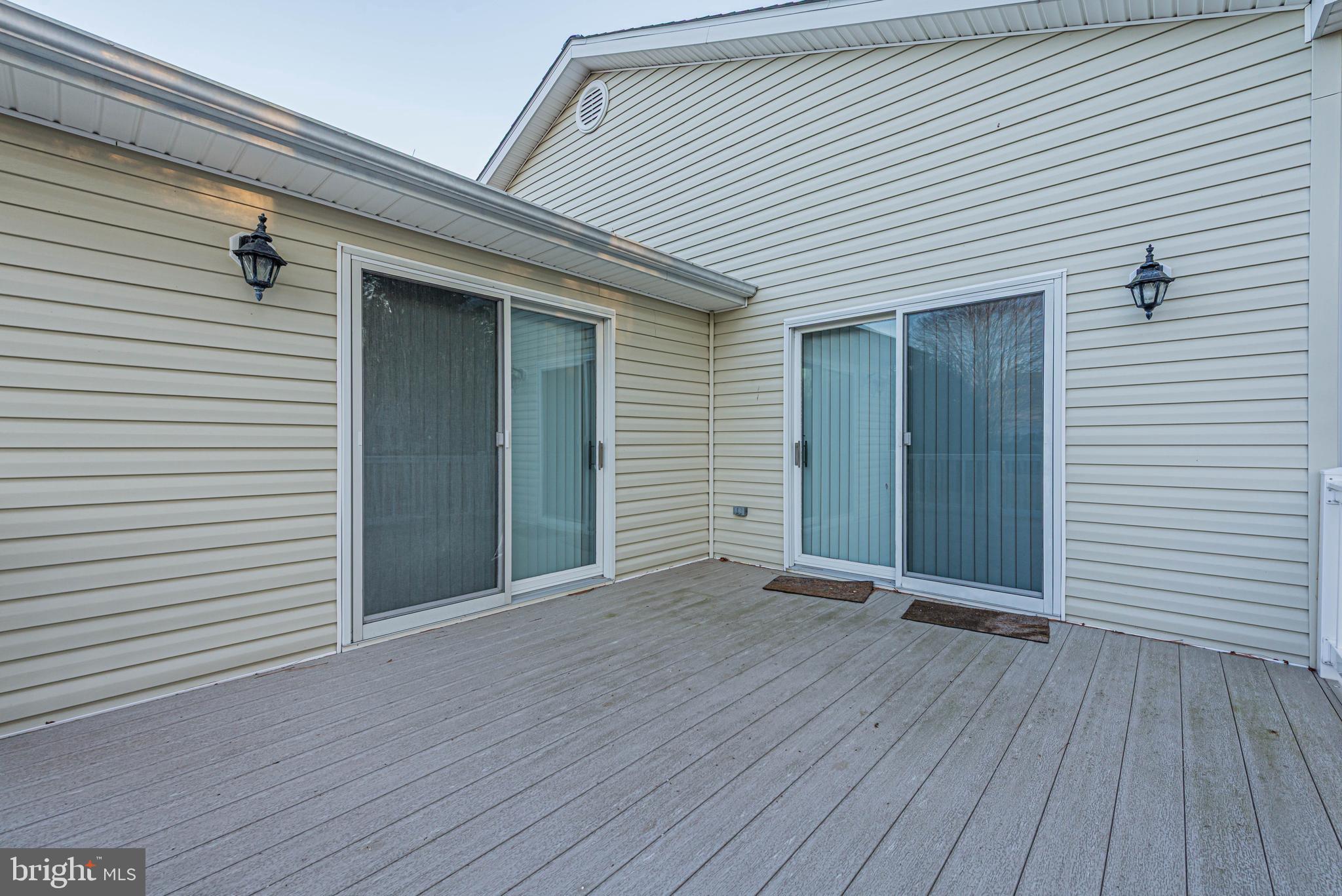 35772 Egret Road Selbyville, DE 19975 - Photo 8 of 38 a view of an empty room with wooden floor