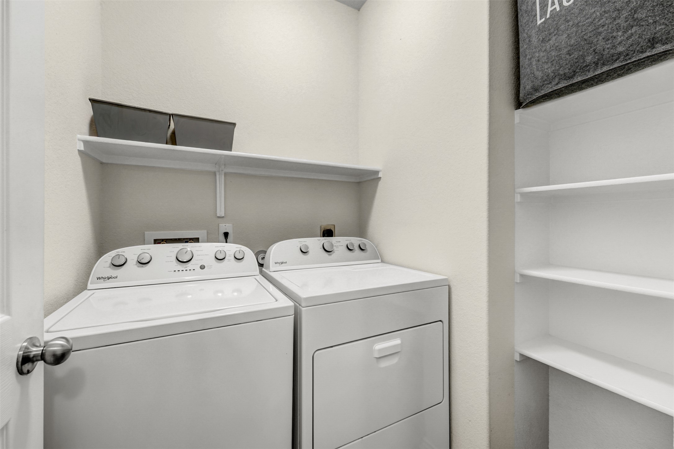 213 Ibis Falls Loop Jarrell, TX 76537 - Photo 26 of 37 Functional utility room with convenient built-in shelving.