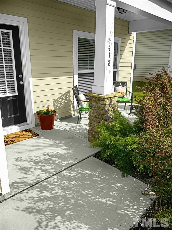 4418 Cardinal Grove Boulevard Raleigh, NC 27616 - Photo 2 of 23 Rocking chair front porch with stone accented columns