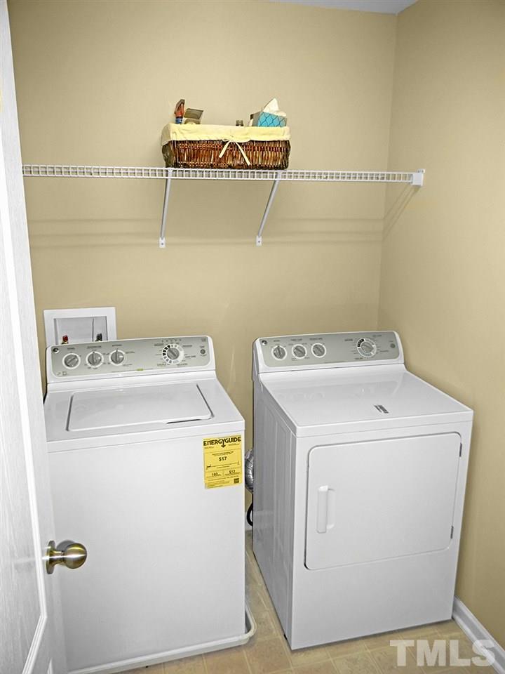 4418 Cardinal Grove Boulevard Raleigh, NC 27616 - Photo 17 of 23 Large upstairs laundry room with plenty of room for hampers and storage.