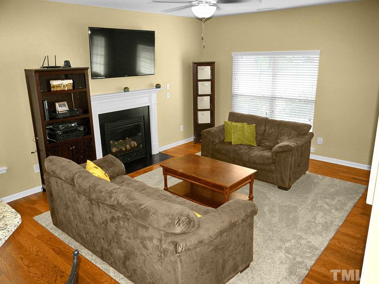 4418 Cardinal Grove Boulevard Raleigh, NC 27616 - Photo 3 of 23 Hardwood floors, gas log fireplace with mantel, 9-foot ceilings