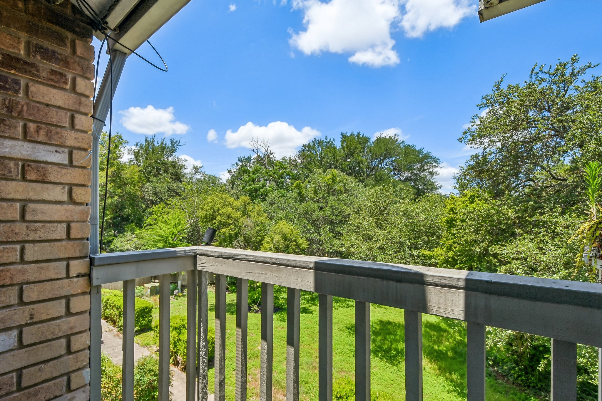 4202 Hudson Bend Road, Unit B Austin, TX 78734 - Photo 21 of 26 a view of a balcony with flower plants