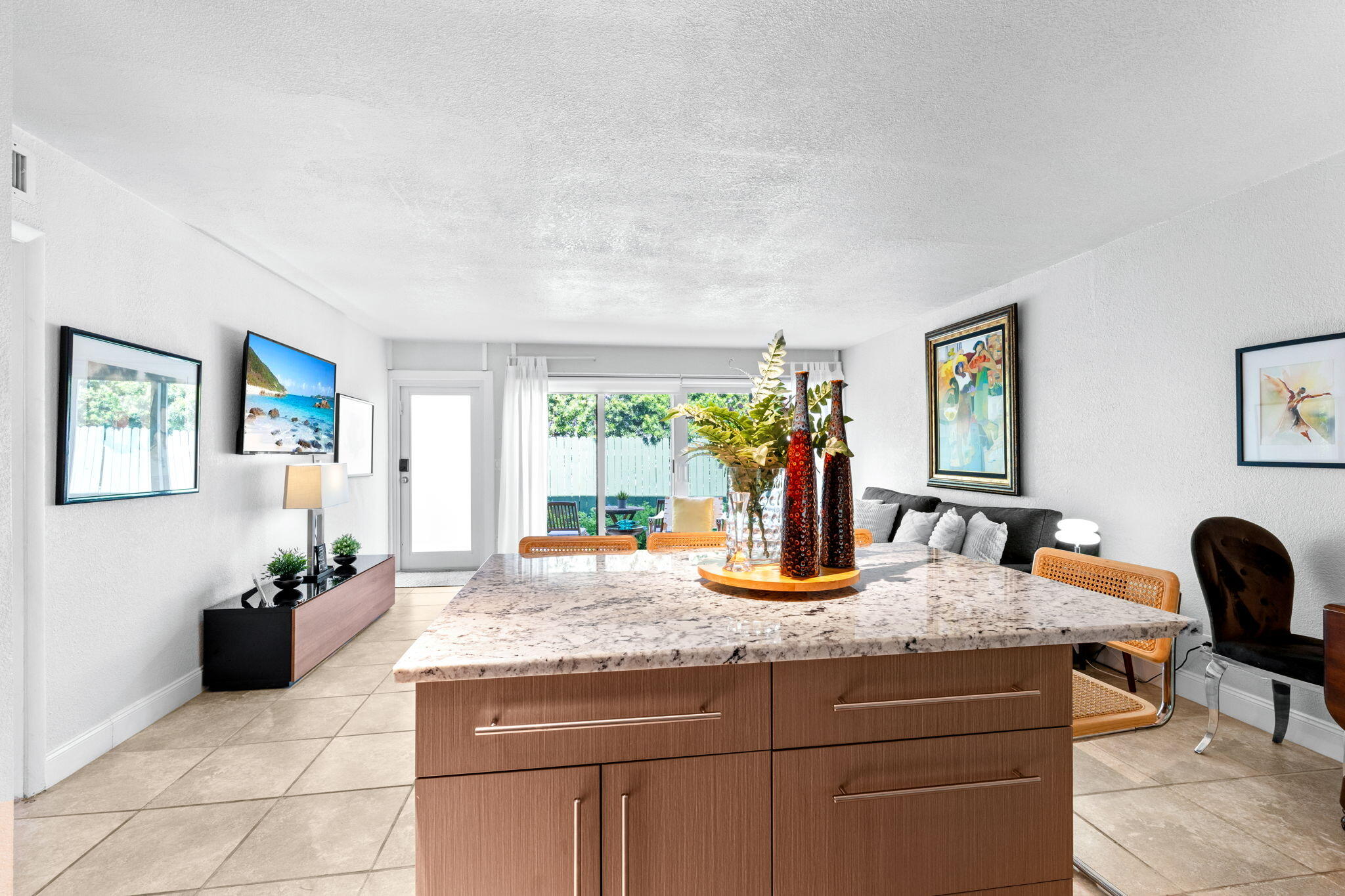 3725 South Olive Avenue, Unit A West Palm Beach, FL 33405 - Photo 19 of 35 a dining table with chairs and window