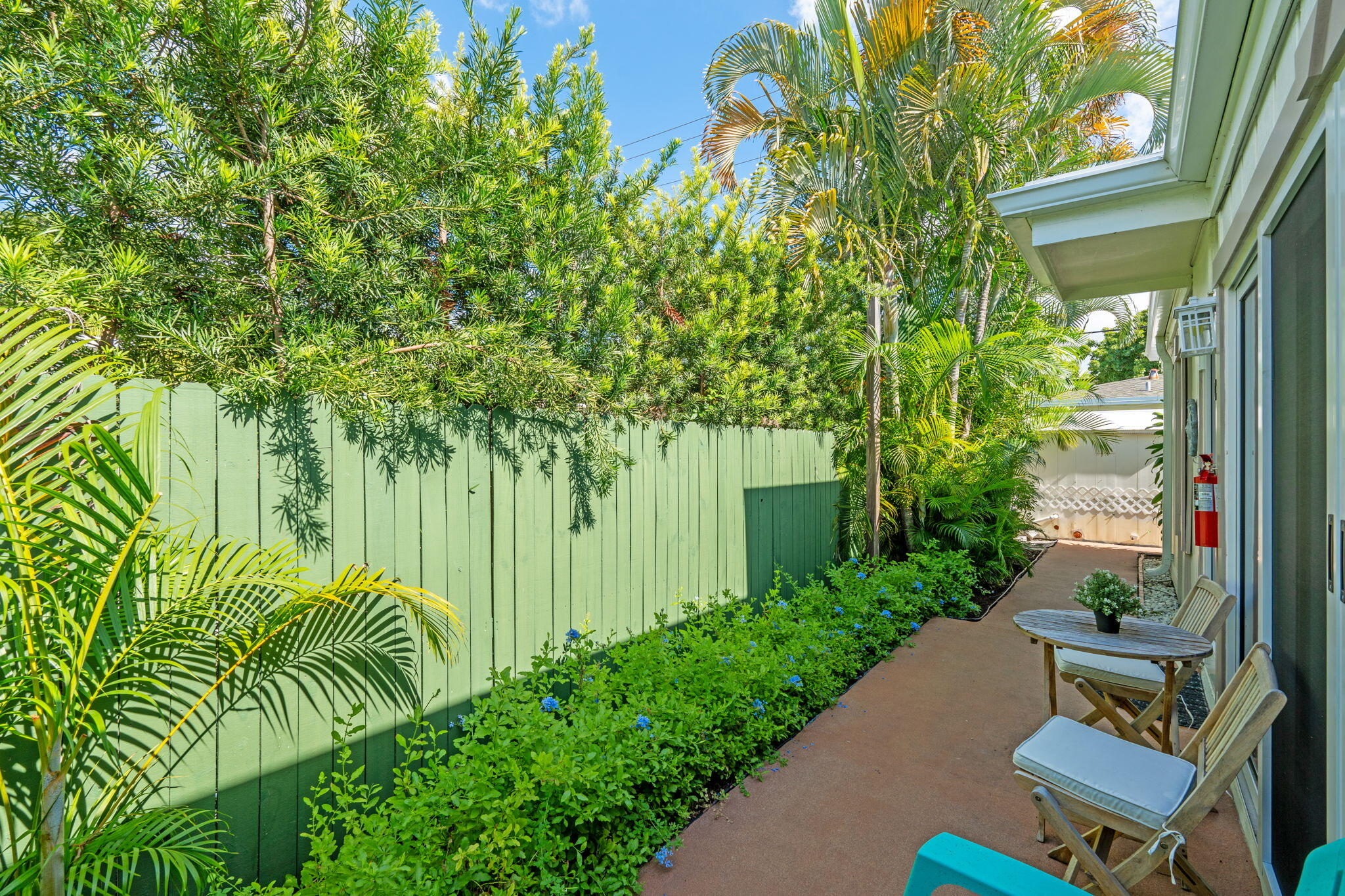 3725 South Olive Avenue, Unit A West Palm Beach, FL 33405 - Photo 32 of 35 a view of a backyard with plants