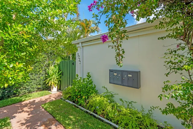 a sign that is sitting in front of a house