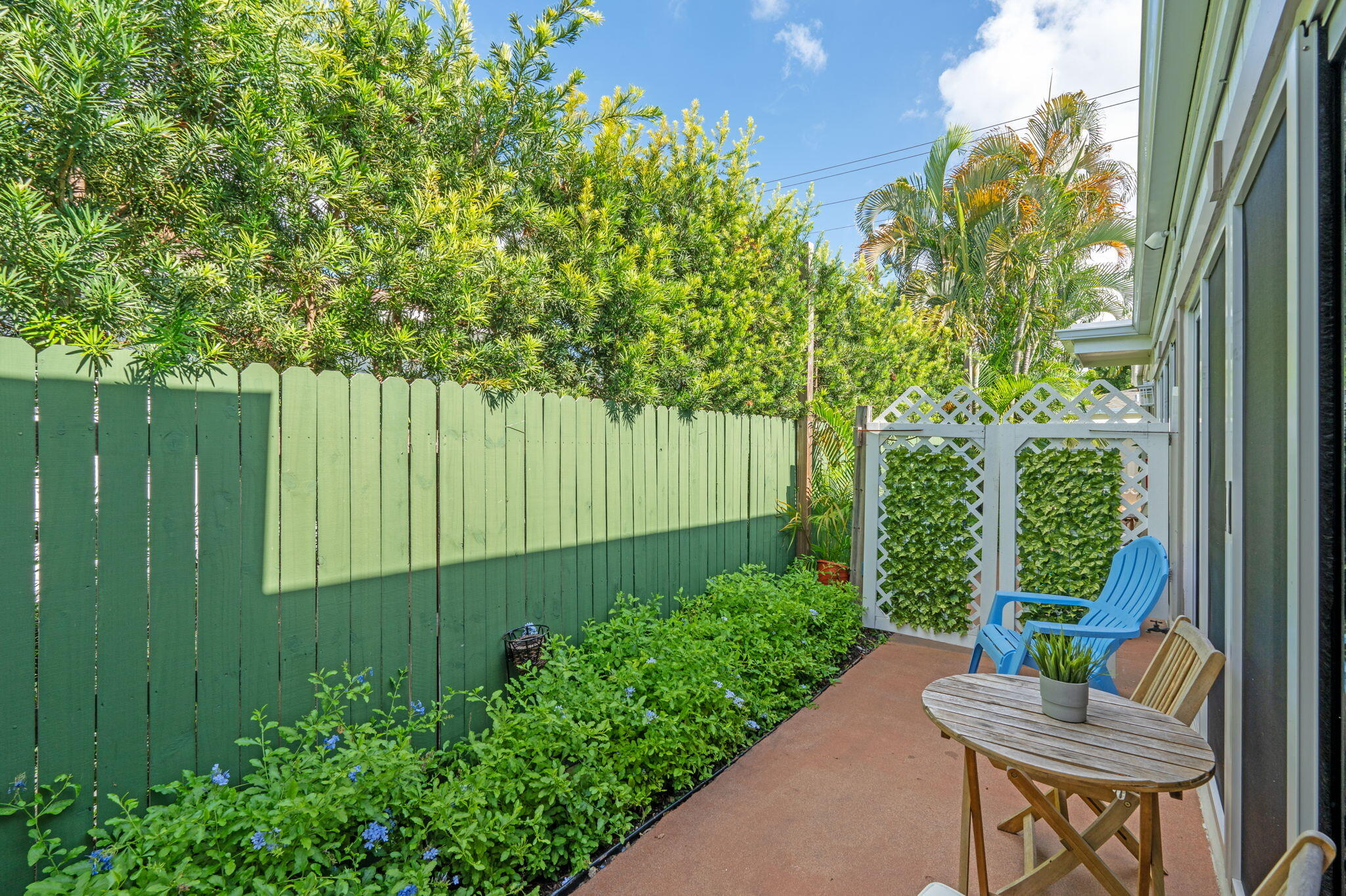 3725 South Olive Avenue, Unit A West Palm Beach, FL 33405 - Photo 6 of 35 a garden view with a seating space