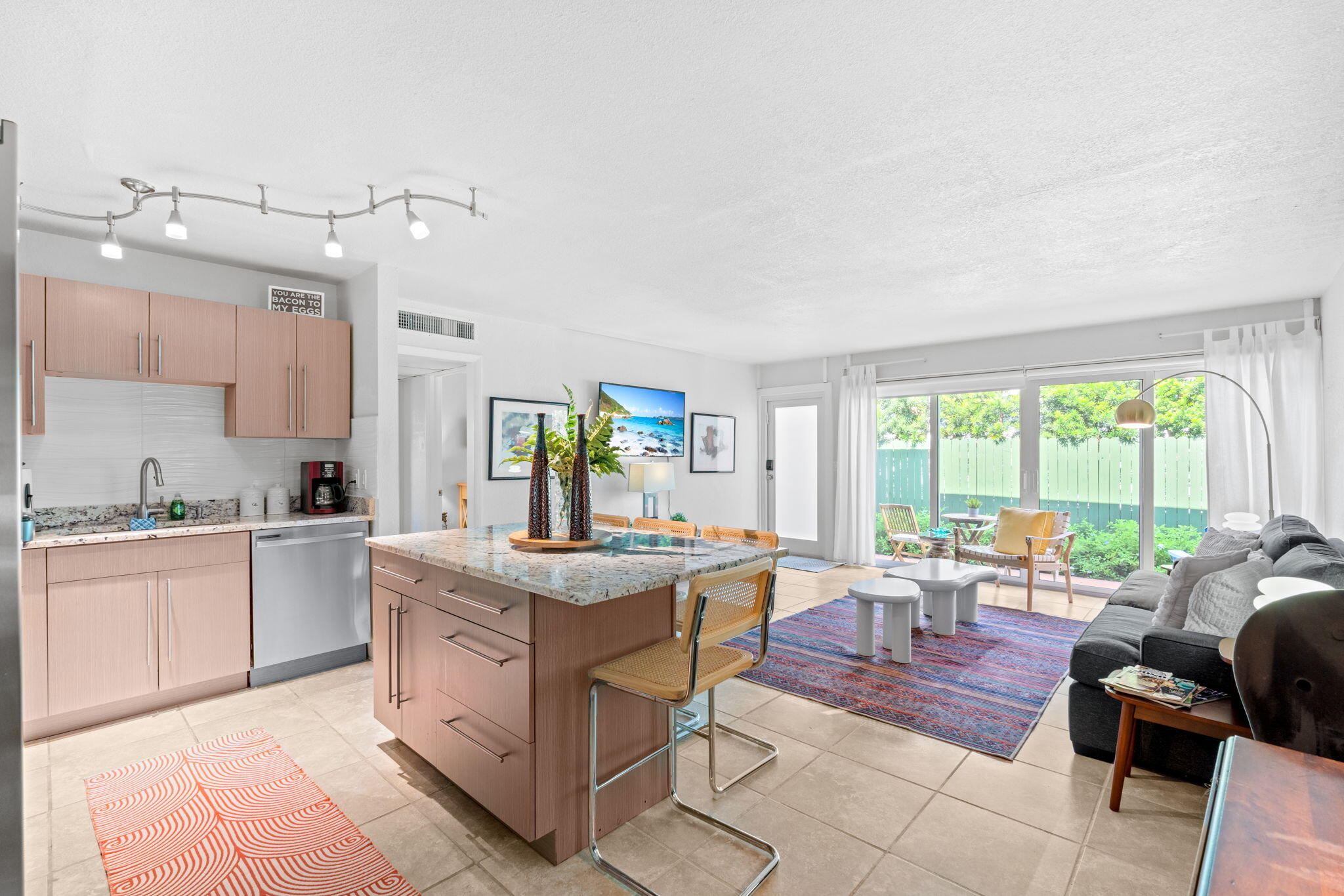 3725 South Olive Avenue, Unit A West Palm Beach, FL 33405 - Photo 9 of 35 a view of a kitchen counter top space with stainless steel appliances granite countertop furniture and a sink