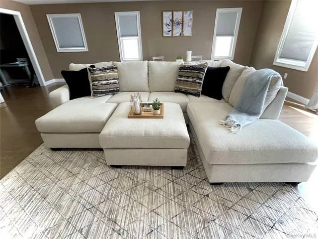 a living room with a couch and a flat screen tv