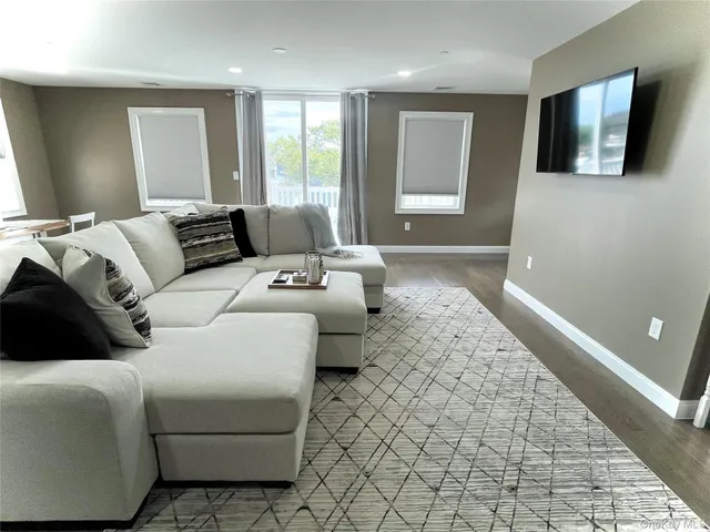 a view of a dining room with furniture and window