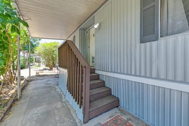 a view of a house with wooden stairs