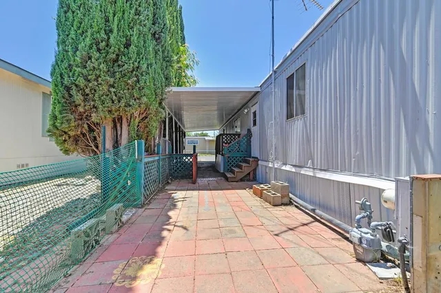 a view of a backyard with sitting area