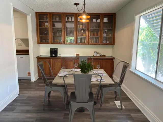 a view of a dining room with furniture window and outside view
