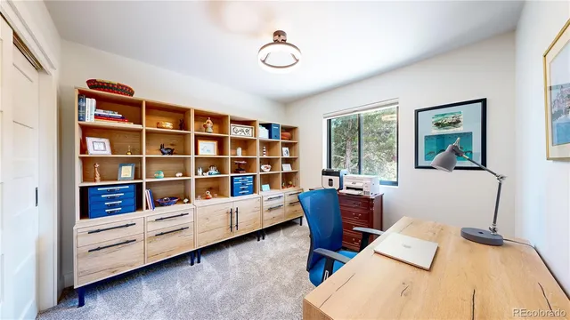 a workspace with furniture and window