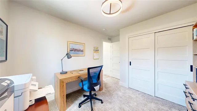 a view of a workspace with furniture