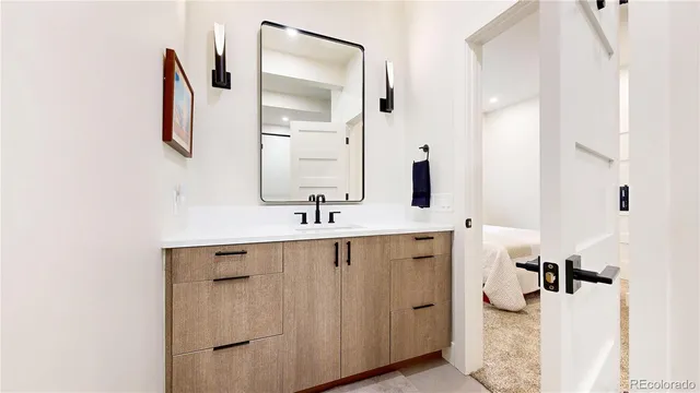a bathroom with a sink and mirror