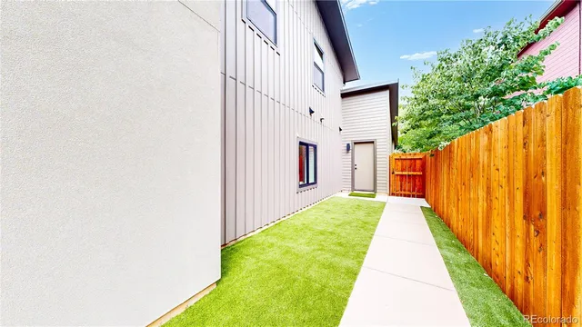 a view of a backyard with pathway