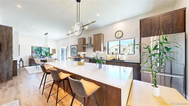 a large kitchen with a table and chairs
