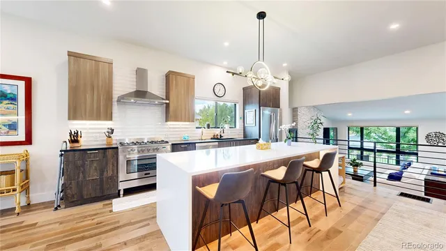 a large kitchen with a table and chairs